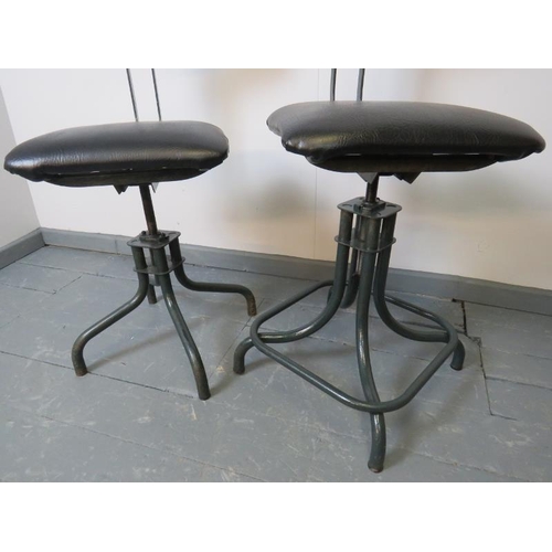 750 - A near pair of vintage C&N model 1940s industrial machinist’s stools, with adjustable plywood backre... 