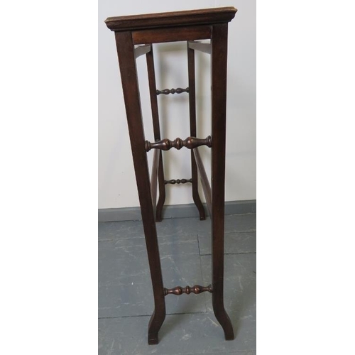 757 - A turn of the century mahogany double towel rail, strung with satinwood, featuring turned side spind... 