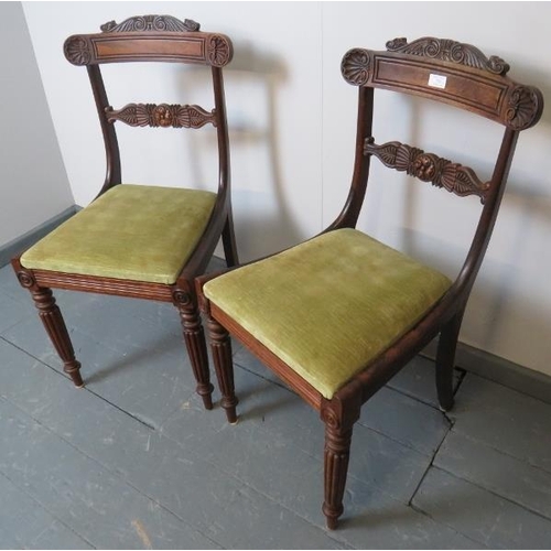 758 - A pair of William IV rosewood occasional chairs with green velvet drop-in seat pads and featuring or... 