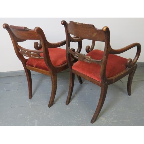 761 - A near pair of Regency mahogany carver chairs, featuring gadrooned detail, ornately carved and pierc... 