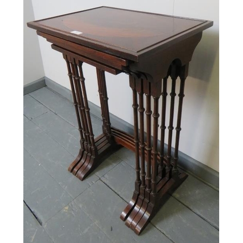 763 - A quartetto of Edwardian Regency revival mahogany nesting tables, featuring flame mahogany inlay and... 