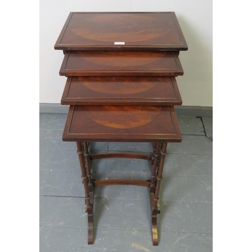 763 - A quartetto of Edwardian Regency revival mahogany nesting tables, featuring flame mahogany inlay and... 