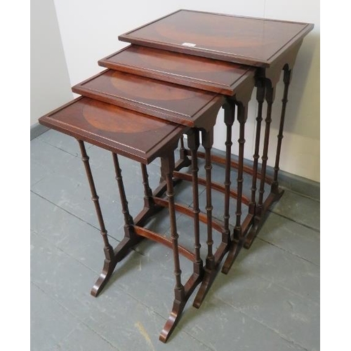 763 - A quartetto of Edwardian Regency revival mahogany nesting tables, featuring flame mahogany inlay and... 