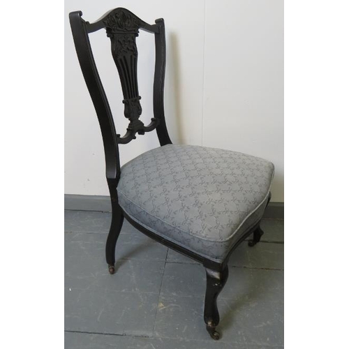 767 - A pair of Edwardian ebonised bedroom chairs, with lyre backs, upholstered in blue pattered material,... 