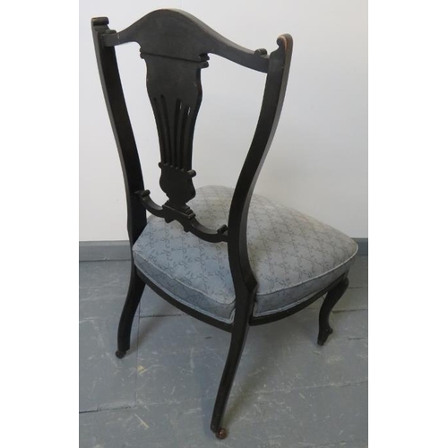 767 - A pair of Edwardian ebonised bedroom chairs, with lyre backs, upholstered in blue pattered material,... 