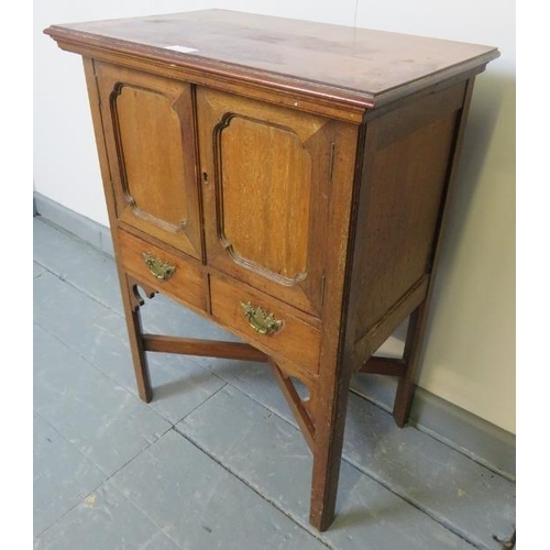 773 - A small Edwardian mahogany side cabinet in the Georgian taste, the twin doors opening onto a shelved... 