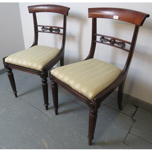 775 - A pair of Regency mahogany occasional chairs, with foliate carved and pierced backrests, on tapering... 