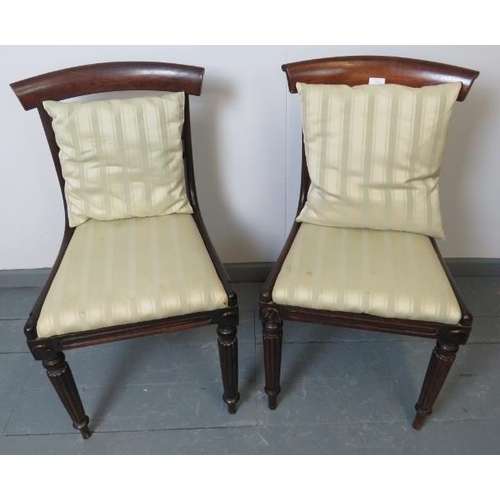 775 - A pair of Regency mahogany occasional chairs, with foliate carved and pierced backrests, on tapering... 