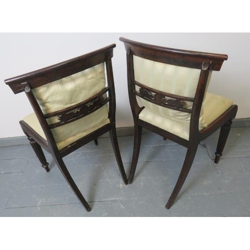 775 - A pair of Regency mahogany occasional chairs, with foliate carved and pierced backrests, on tapering... 