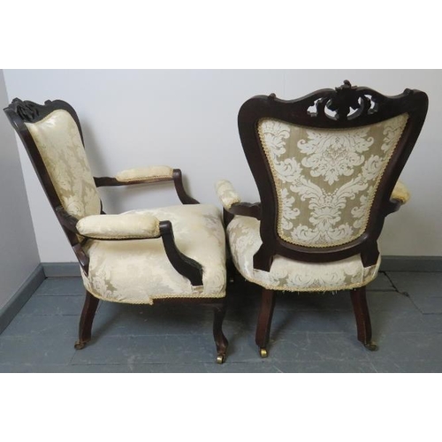 776 - A pair of Victorian mahogany open-sided armchairs, with acanthus carved and pierced cornice and foli... 