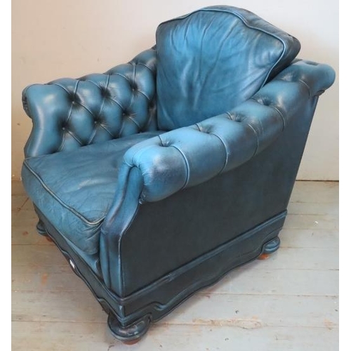 792 - A vintage chesterfield club armchair by Andrew Muirhead, upholstered in buttoned blue leather, raise... 