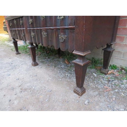 800 - An 18th century Spanish oak linen press with ornately carved pierced shaped cornice over twin cupboa... 