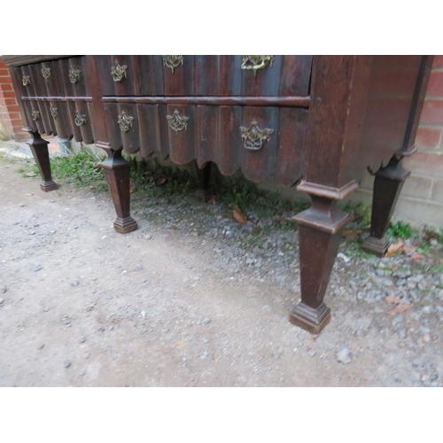 800 - An 18th century Spanish oak linen press with ornately carved pierced shaped cornice over twin cupboa... 