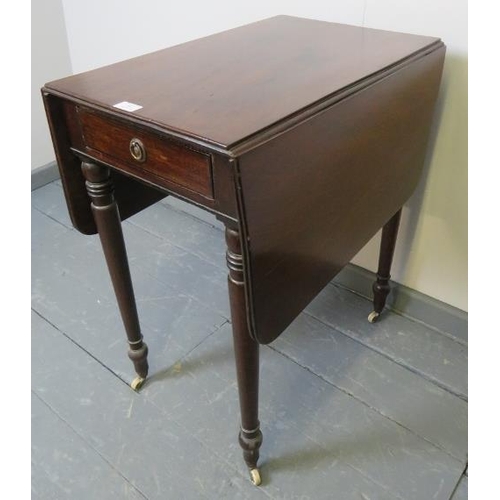 803 - A small Victorian mahogany Pembroke table, with single frieze drawer and dummy drawer to opposite si... 