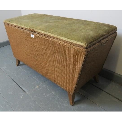 804 - A vintage Lloyd Loom style ottoman painted gold, with velvet upholstered lid, on sabre legs. 
Condit... 