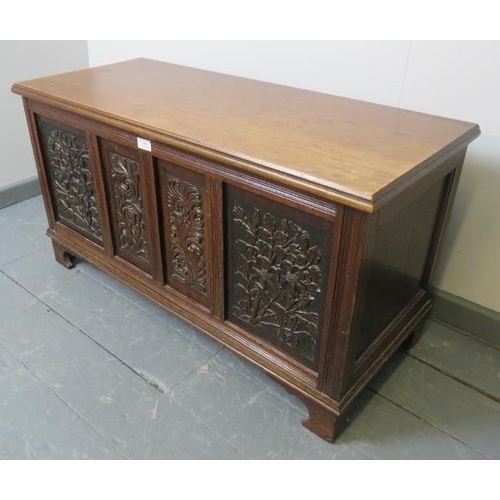 806 - A small vintage oak coffer/blanket box in a 17th century style, the front with relief carved foliate... 