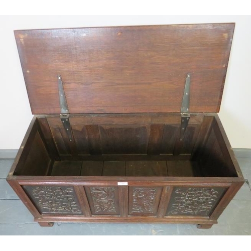 806 - A small vintage oak coffer/blanket box in a 17th century style, the front with relief carved foliate... 