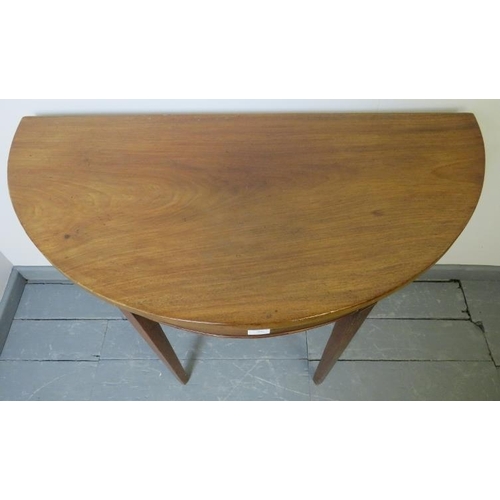 808 - A Georgian mahogany demi lune console table, on tapering square supports. 
Condition report: Minor m... 