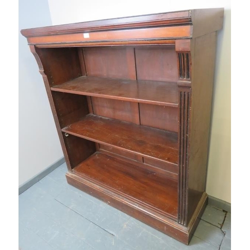 811 - An Edwardian mahogany tall open bookcase of three height adjustable shelves, flanked by reeded colum... 