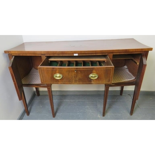 813 - A George III mahogany bow fronted sideboard with central cutlery drawer flanked by cupboards, featur... 