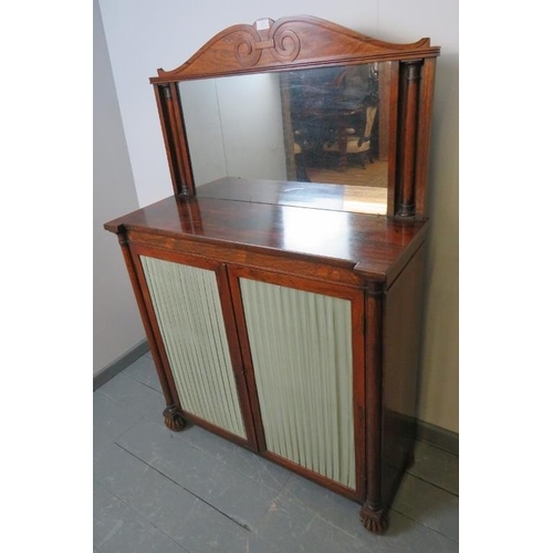 815 - A Regency rosewood mirror back chiffonier, with scrolled cornice and half- columns to either side, t... 