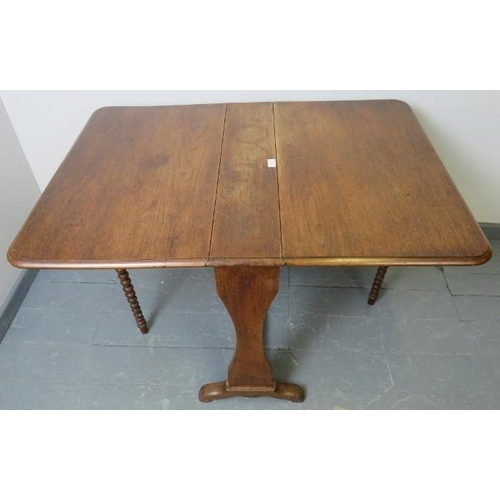 819 - A Victorian oak Sutherland table, featuring ball turned gate-leg supports.
Condition report: Minor m... 