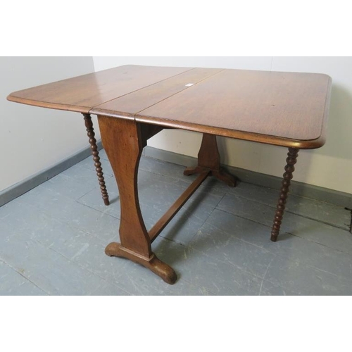 819 - A Victorian oak Sutherland table, featuring ball turned gate-leg supports.
Condition report: Minor m... 