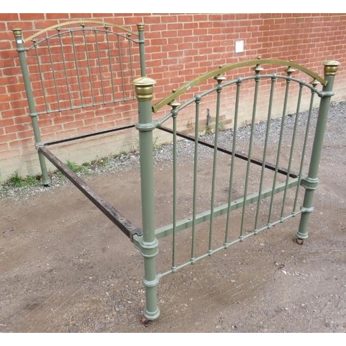 828 - A Victorian wrought iron and brass single bed painted olive green, on ceramic castors.
Condition rep... 