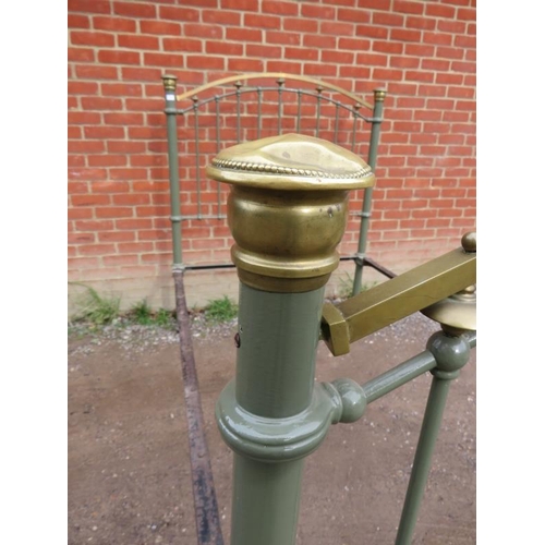 828 - A Victorian wrought iron and brass single bed painted olive green, on ceramic castors.
Condition rep... 