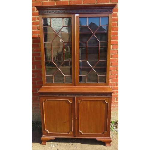 829 - An Edwardian mahogany display bookcase, with dentil cornice and blind fret frieze, the two astral gl... 