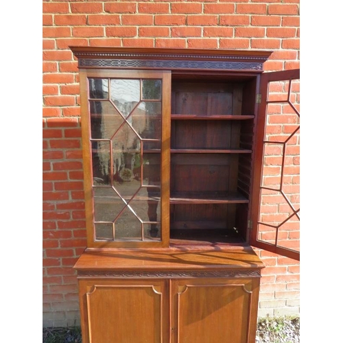 829 - An Edwardian mahogany display bookcase, with dentil cornice and blind fret frieze, the two astral gl... 