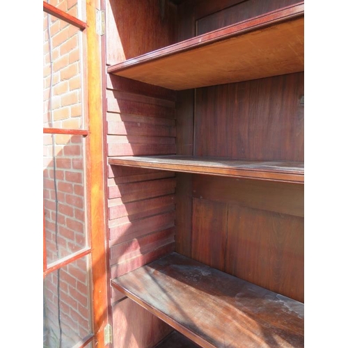 829 - An Edwardian mahogany display bookcase, with dentil cornice and blind fret frieze, the two astral gl... 