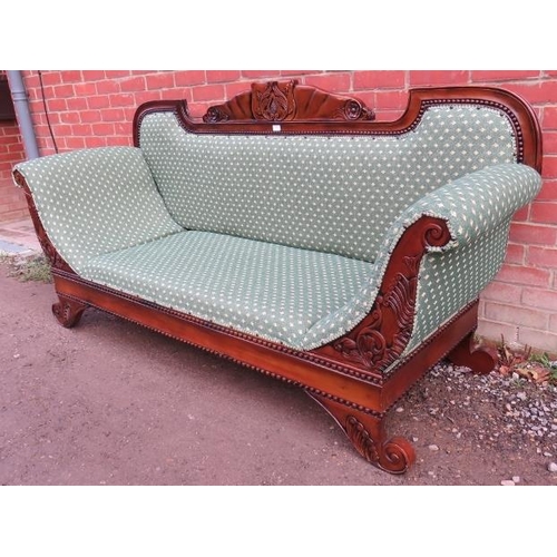 834 - A large vintage show-wood daybed, the frame ornately carved with acanthus leaves and roundels, raise... 