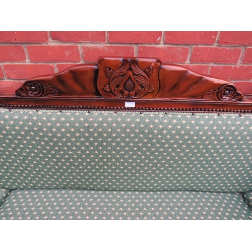 834 - A large vintage show-wood daybed, the frame ornately carved with acanthus leaves and roundels, raise... 