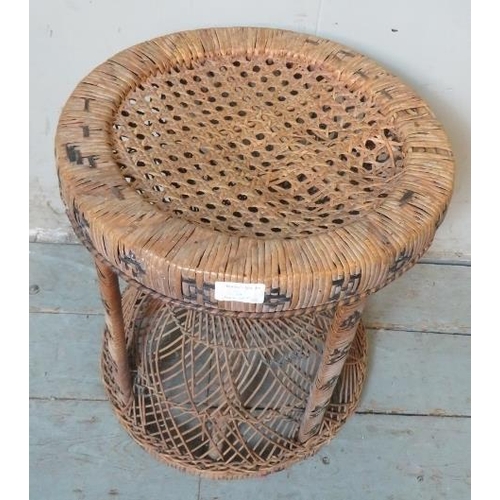 835 - A vintage wicker ‘peacock’ stool.
Condition report: Some damage to wickerwork.
H: 46cm Diameter: 39c... 