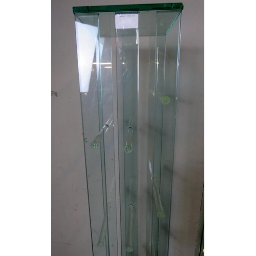 836 - A pair of contemporary glass shelving units by Greenapple furniture company, each housing six shelve... 