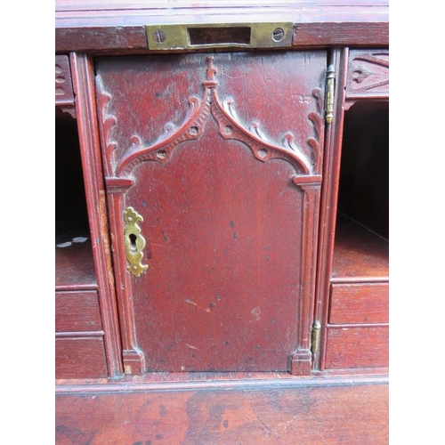 838 - A 18th century mahogany bureau bookcase featuring dentil cornice and blind fret frieze, the twin doo... 