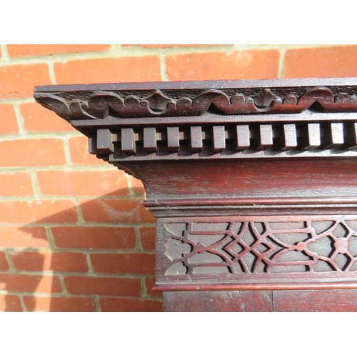 838 - A 18th century mahogany bureau bookcase featuring dentil cornice and blind fret frieze, the twin doo... 