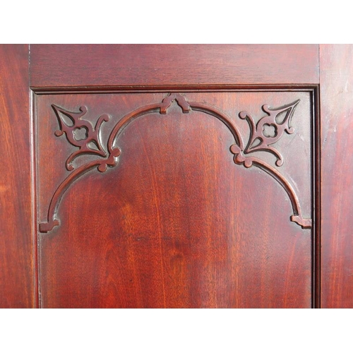 838 - A 18th century mahogany bureau bookcase featuring dentil cornice and blind fret frieze, the twin doo... 