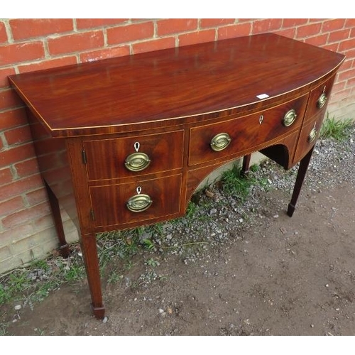 845 - A Georgian flame mahogany bow fronted sideboard of small proportions, strung with satinwood and ebon... 