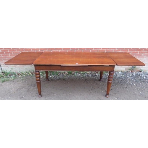 847 - A good quality reproduction cherrywood draw leaf dining table by Niko, raised on tapering turned sup... 