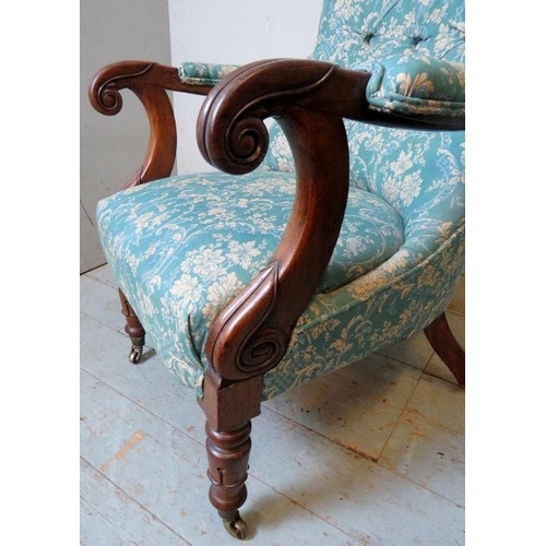 848 - A Victorian mahogany open-sided button-back armchair, with scrolled armrests, raised on tapering tur... 