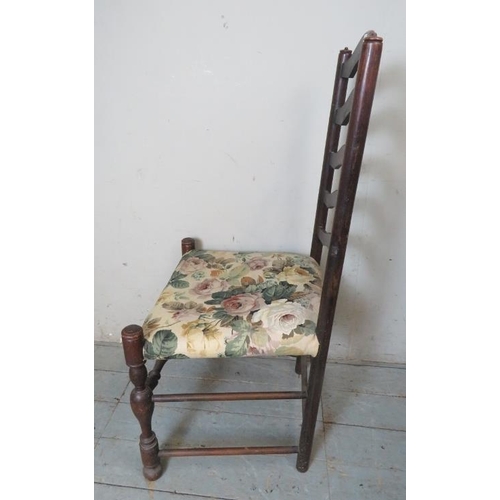 850 - Four 19th century ladder back chairs raised on baluster turned supports with stretchers, terminating... 