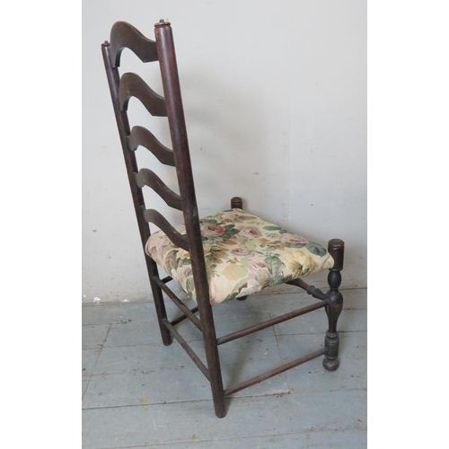 850 - Four 19th century ladder back chairs raised on baluster turned supports with stretchers, terminating... 