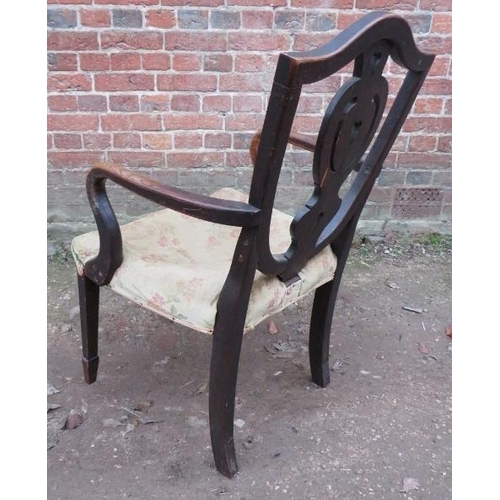 855 - A Georgian country made oak shield back open sided elbow chair, the carved and pierced back splat de... 