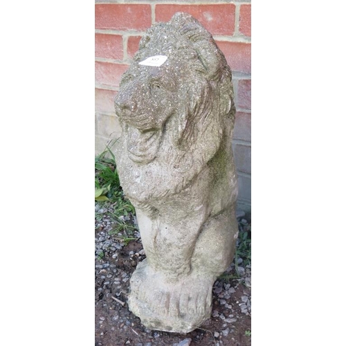 857 - A nicely weathered reconstituted stone garden ornament in the form of a lion.
Condition report: No i... 