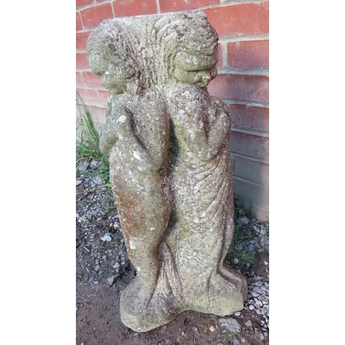 858 - A nicely weathered reconstituted stone garden ornament in the form of three classical maidens.
Condi... 