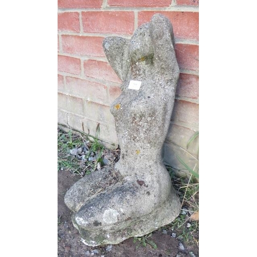 860 - A nicely weathered reconstituted stone garden ornament in the form of a nude posing. 
Condition repo... 