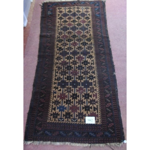 902 - An early to mid 20th Century Persian rug. 216cm x 105cm.
Condition report: Some old repairs and wear... 