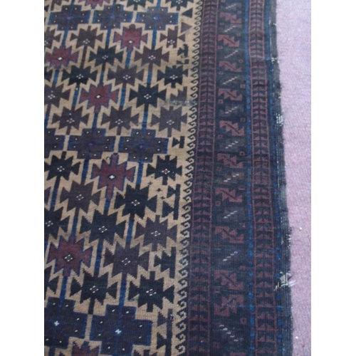 902 - An early to mid 20th Century Persian rug. 216cm x 105cm.
Condition report: Some old repairs and wear... 